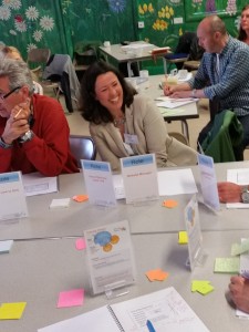 A participant enjoys learning how to play multiple 'Roles' during a 'Tactical' meeting - at a Holacracy training workshop